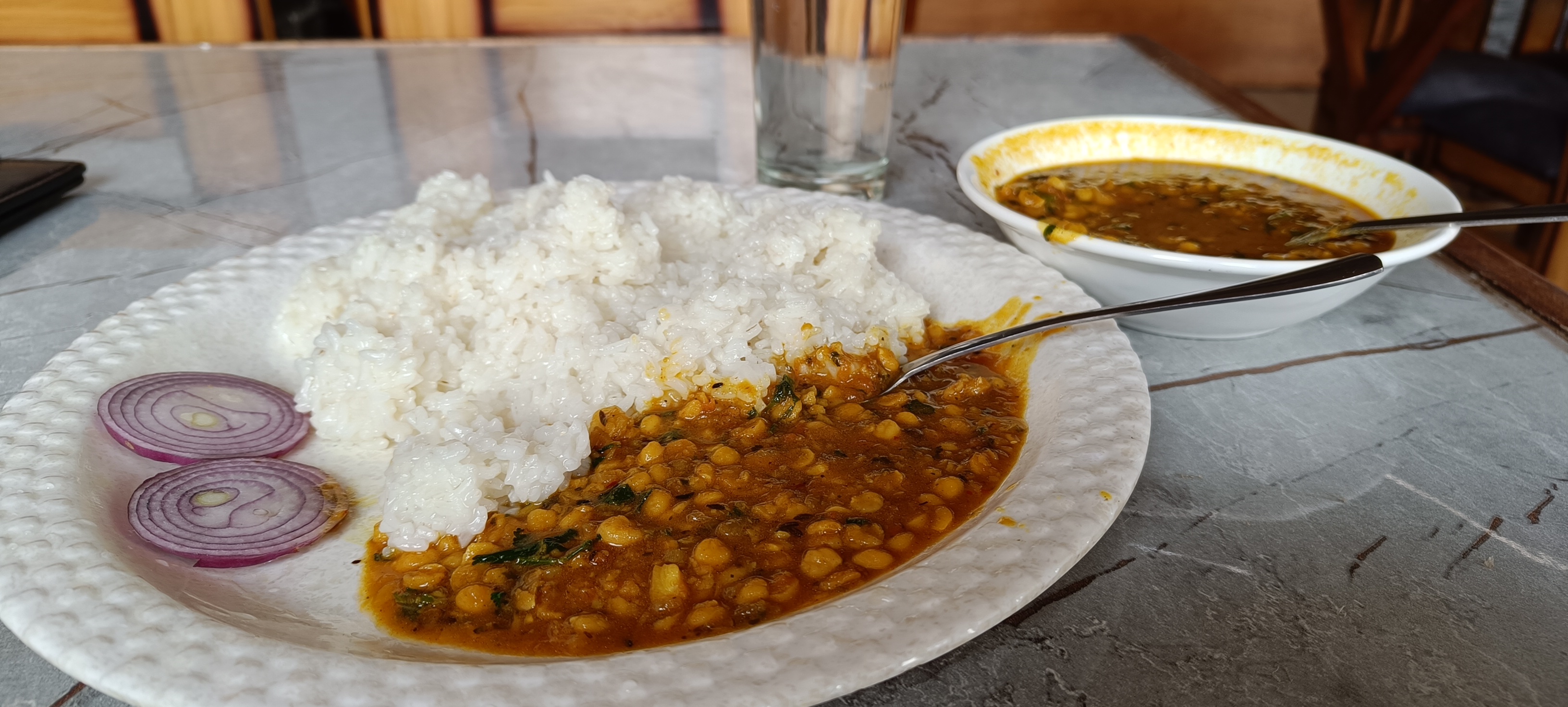 A plate of fresh dal, rice and curry served at Trimounts